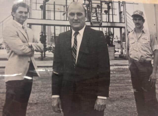 Retif founder Milton Retif standing in front of two other Retif members.